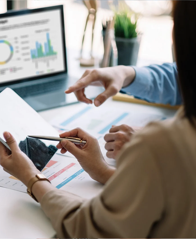 Desilo team analyzing customer loyalty and LTV metrics on tablet and laptop dashboards to support brand scaling and growth